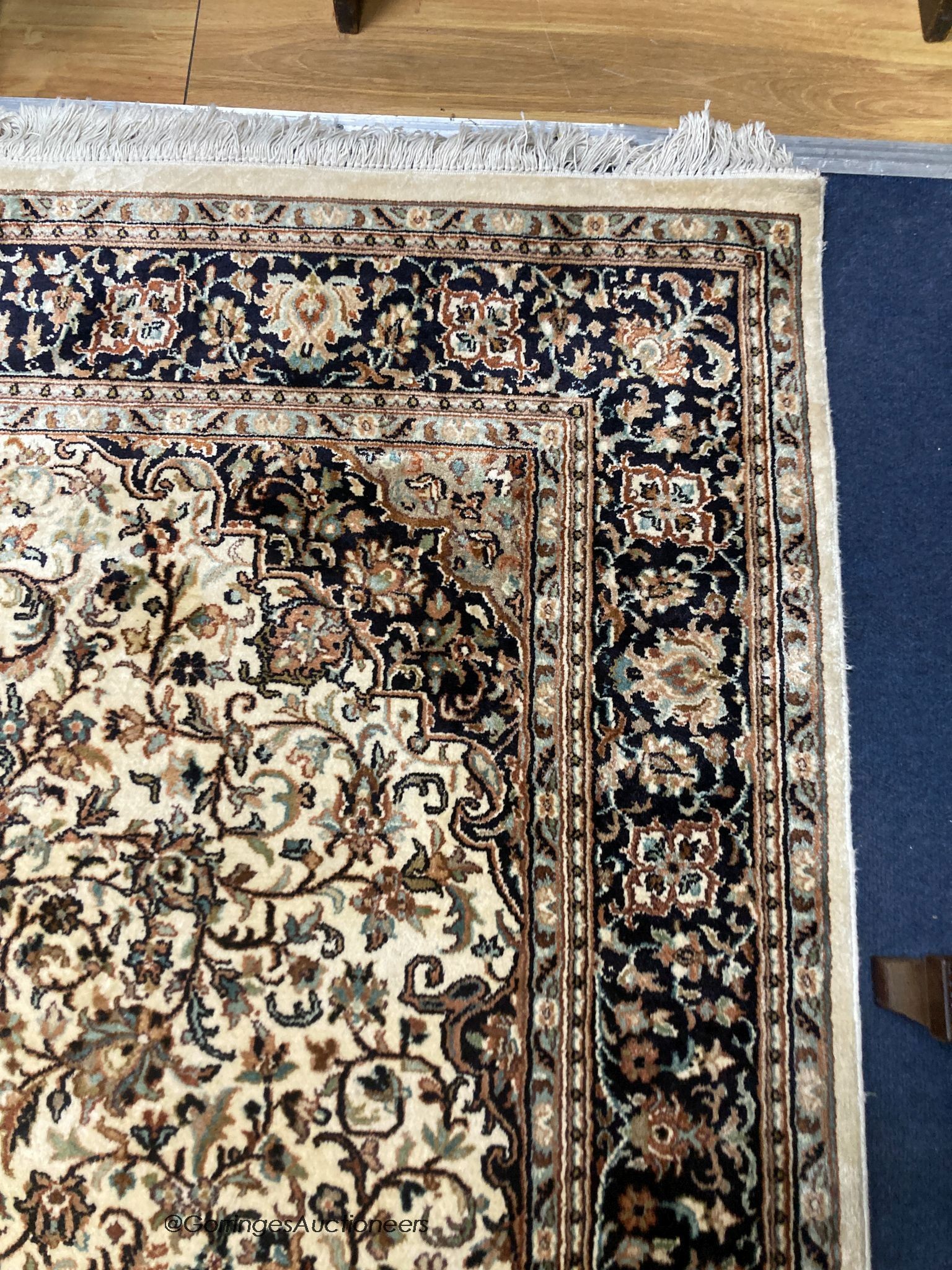 An ivory ground Kashmiri rug, 184 x 124cm